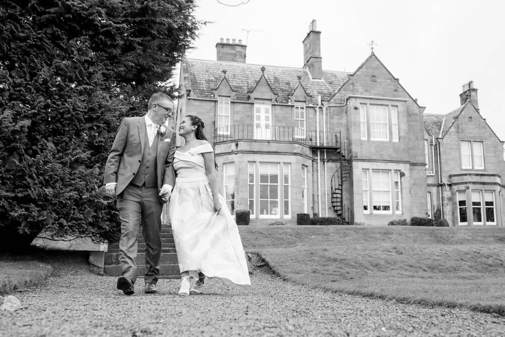 Bride and Groom with Norton House in background