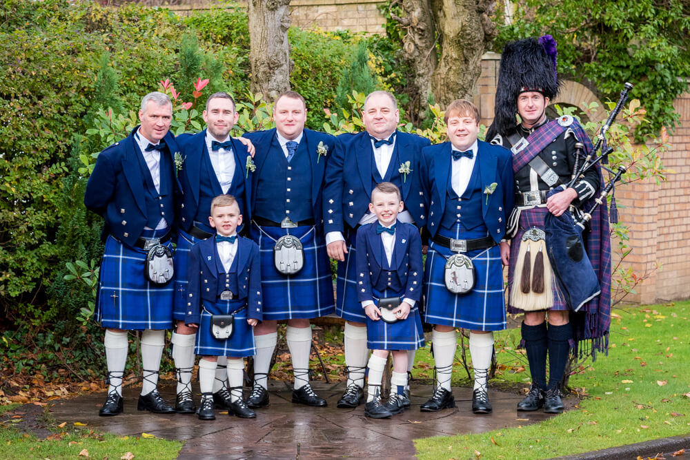 Groom with his ushers and piper