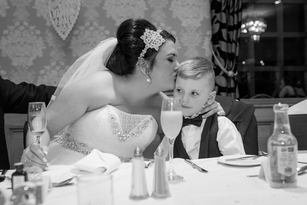 Bride kissing her son