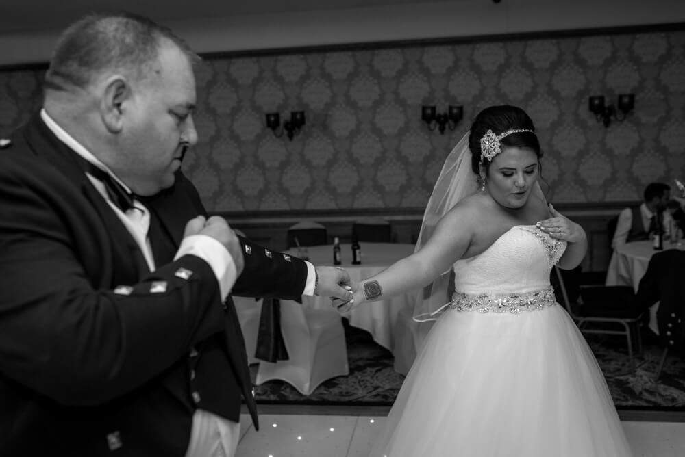 Bride and father of the bride dancing