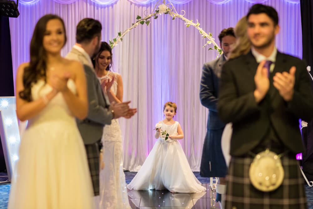Cute flower girl, brides and grooms during Edinburgh Wedding Exhibition