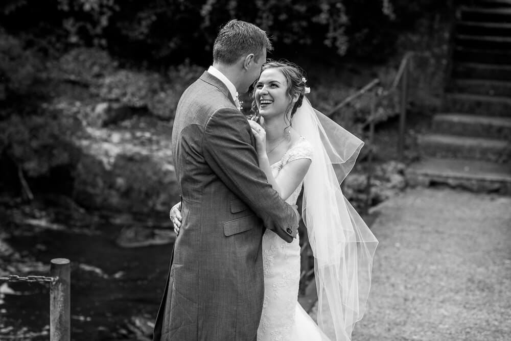 Bride laughing with groom